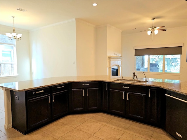 22106 Flashing Ridge Dr, Spring, TX 77389 - kitchen with dishwasher, light tile patterned floors, light stone countertops, ornamental molding, and a chandelier