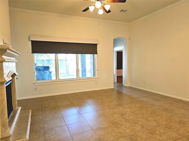 22106 Flashing Ridge Dr, Spring, TX 77389 - unfurnished living room featuring arched walkways, a ceiling fan, crown molding, a fireplace with raised hearth, and tile patterned floors