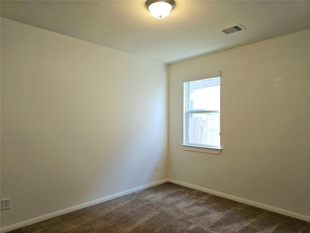 22106 Flashing Ridge Dr, Spring, TX 77389 - empty room featuring dark colored carpet and baseboards