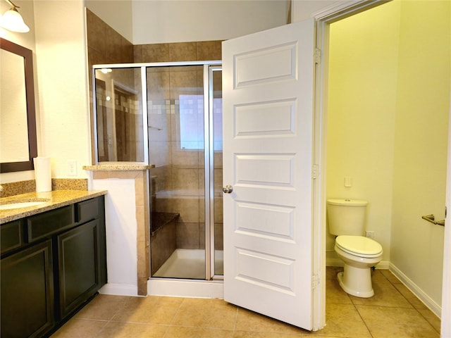 22106 Flashing Ridge Dr, Spring, TX 77389 - bathroom featuring tile patterned floors, vanity, and a stall shower
