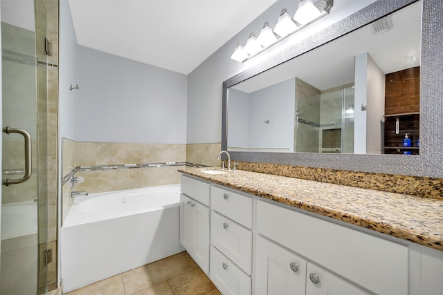 21614 Bowcreek Ln, Katy, TX 77449 - bathroom featuring vanity, a bath, a shower stall, and tile patterned flooring