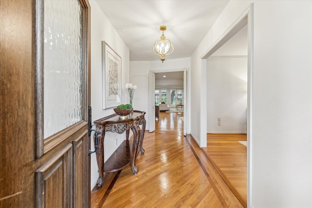 13307 Westport Ln, Houston, TX 77079 - entryway with a chandelier and light wood-type flooring