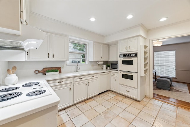 13307 Westport Ln, Houston, TX 77079 - kitchen featuring white appliances, ventilation hood, light countertops, white cabinetry, and ornamental molding