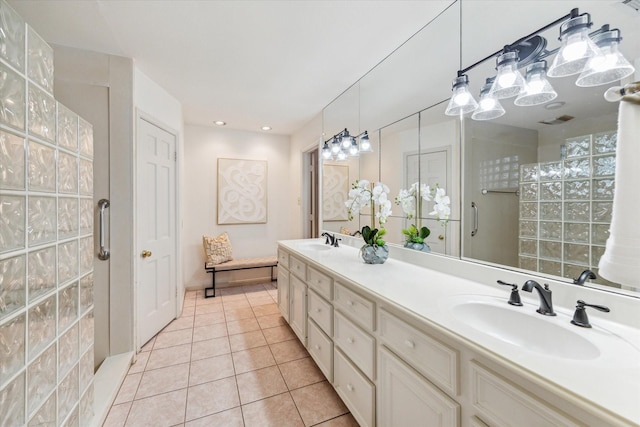 13307 Westport Ln, Houston, TX 77079 - bathroom with double vanity, a tile shower, and tile patterned flooring