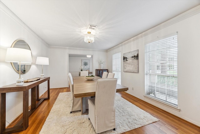 13307 Westport Ln, Houston, TX 77079 - dining room with crown molding, wood finished floors, and a chandelier