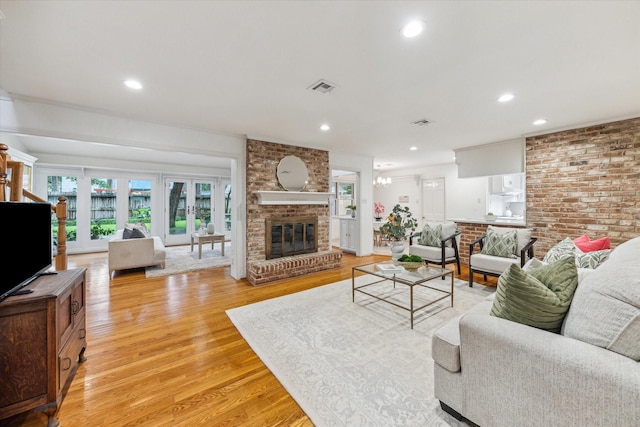 13307 Westport Ln, Houston, TX 77079 - living room with light wood-style flooring, a fireplace, and recessed lighting
