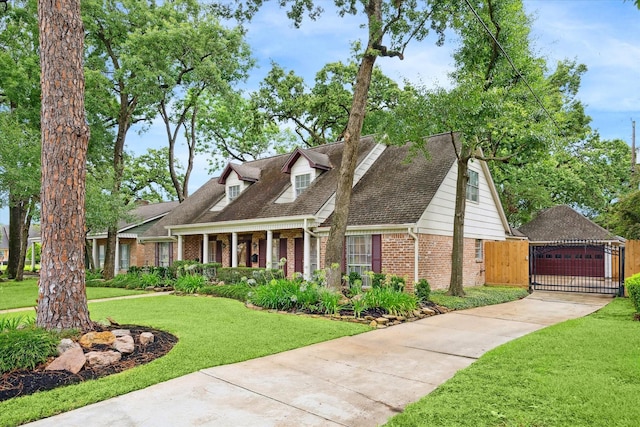 13307 Westport Ln, Houston, TX 77079 - cape cod house with a gate, brick siding, and a shingled roof