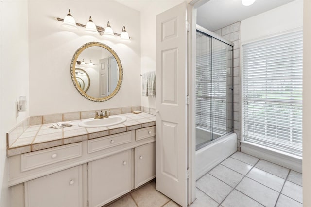 13307 Westport Ln, Houston, TX 77079 - bathroom featuring vanity, tile patterned floors, and combined bath / shower with glass door