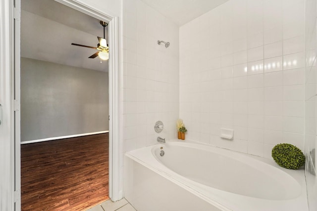 19115 Forest Ridge Dr, Magnolia, TX 77355 - full bathroom featuring a ceiling fan, wood finished floors, and  shower combination
