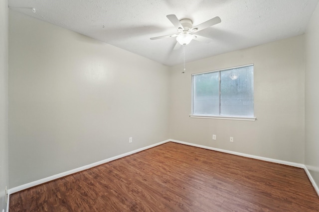 19115 Forest Ridge Dr, Magnolia, TX 77355 - empty room with wood finished floors, a ceiling fan, and a textured ceiling