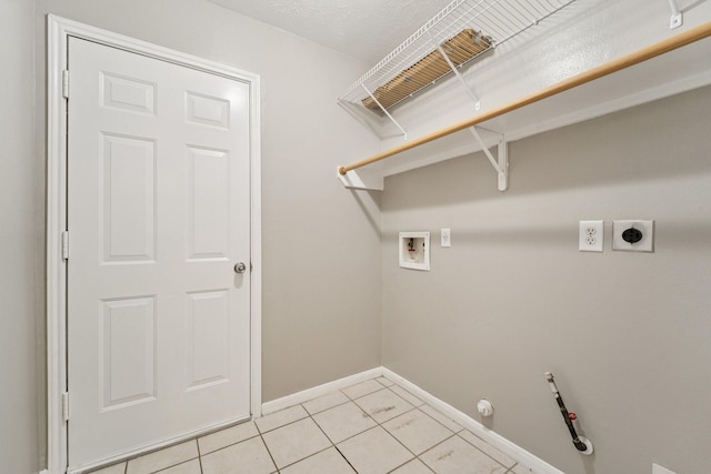 19115 Forest Ridge Dr, Magnolia, TX 77355 - laundry room with washer hookup, hookup for an electric dryer, light tile patterned flooring, and gas dryer hookup