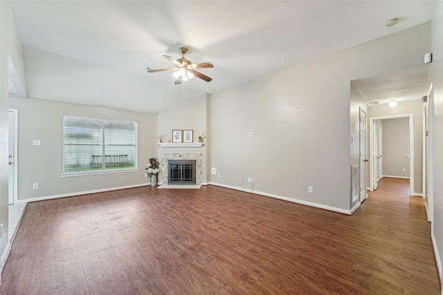 19115 Forest Ridge Dr, Magnolia, TX 77355 - unfurnished living room featuring ceiling fan, wood finished floors, a glass covered fireplace, and lofted ceiling