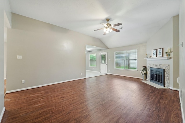 19115 Forest Ridge Dr, Magnolia, TX 77355 - unfurnished living room featuring a ceiling fan, lofted ceiling, wood finished floors, and a tile fireplace