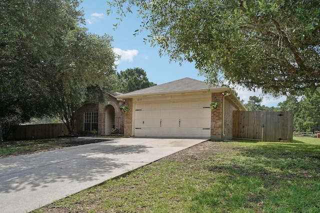 19115 Forest Ridge Dr, Magnolia, TX 77355 - view of front of property with brick siding, an attached garage, and driveway