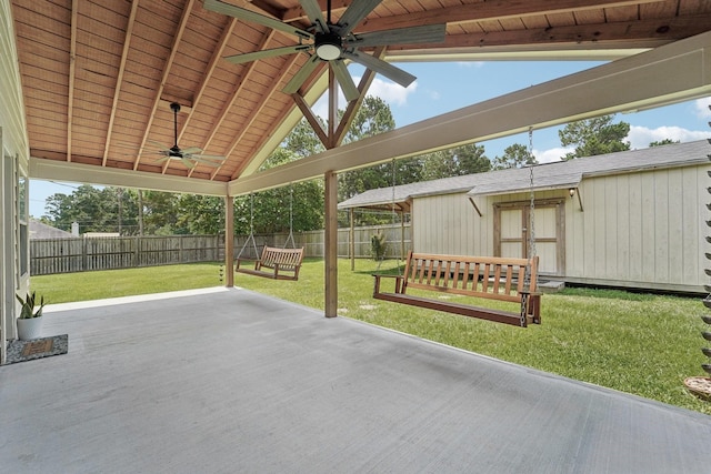 19115 Forest Ridge Dr, Magnolia, TX 77355 - fenced backyard with ceiling fan, a patio area, and an outbuilding