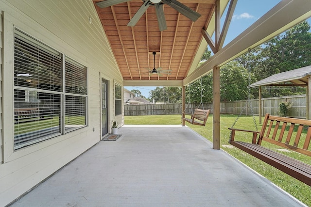 19115 Forest Ridge Dr, Magnolia, TX 77355 - fenced backyard with ceiling fan and a patio