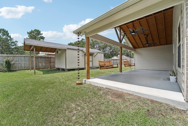 19115 Forest Ridge Dr, Magnolia, TX 77355 - fenced backyard with ceiling fan, a patio area, a storage unit, and a deck