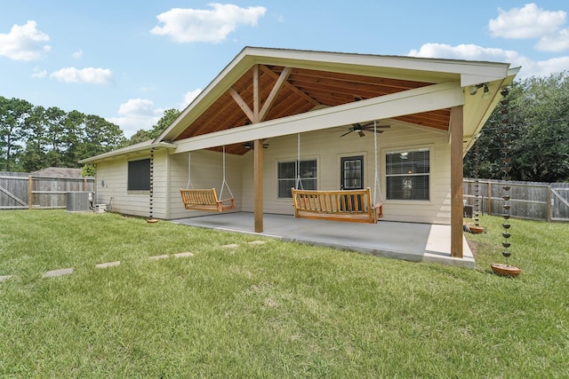 19115 Forest Ridge Dr, Magnolia, TX 77355 - back of property featuring ceiling fan, a patio, and a fenced backyard