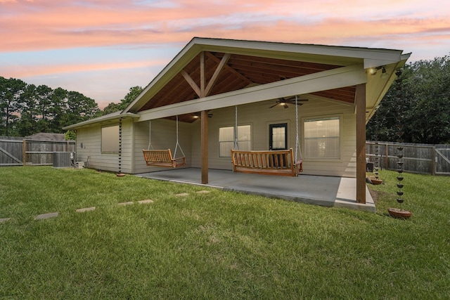 19115 Forest Ridge Dr, Magnolia, TX 77355 - rear view of house with a patio, ceiling fan, a fenced backyard, and a gate