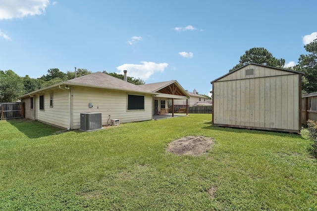 19115 Forest Ridge Dr, Magnolia, TX 77355 - rear view of house featuring a fenced backyard and a storage unit