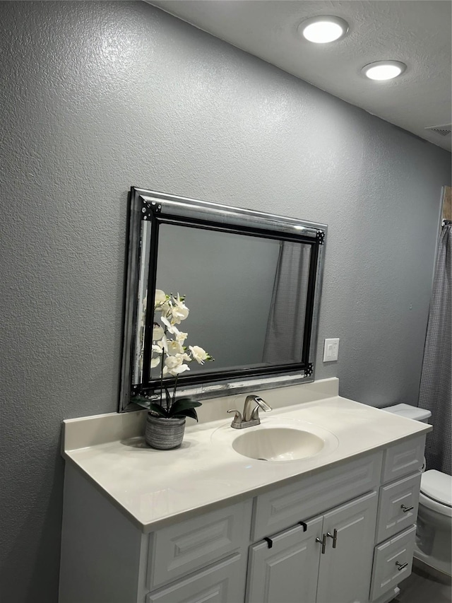 11618 Wren Crossing Dr, Houston, TX 77038 - full bathroom featuring vanity and a textured wall