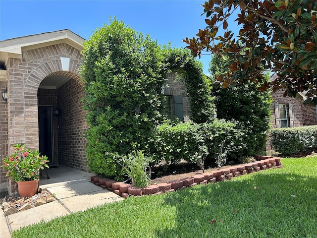 11618 Wren Crossing Dr, Houston, TX 77038 - entrance to property with brick siding and a yard
