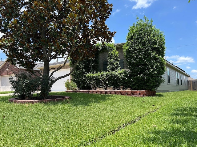 11618 Wren Crossing Dr, Houston, TX 77038 - view of green lawn with a garage