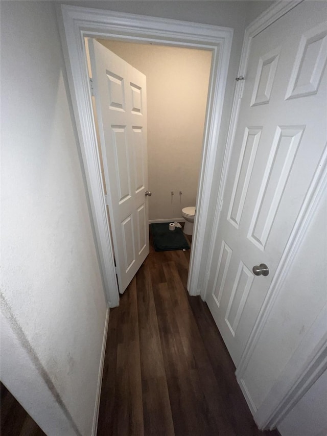 23830 Seeded Meadow Ct, Hockley, TX 77447 - hallway featuring dark wood finished floors and baseboards