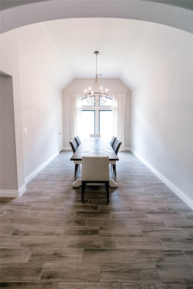 3319 Pleasant Hollow Ln, Houston, TX 77365 - dining area with a chandelier, vaulted ceiling, and dark wood-style floors