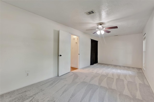 32 Sarita Rd, Angleton, TX 77515 - empty room featuring a ceiling fan, light carpet, and a textured ceiling