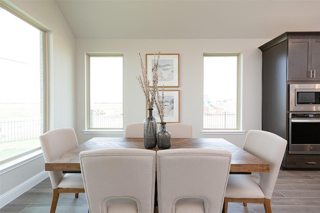 16035 Tangled Vine Ln, Conroe, TX 77302 - dining space with light wood-type flooring and healthy amount of natural light