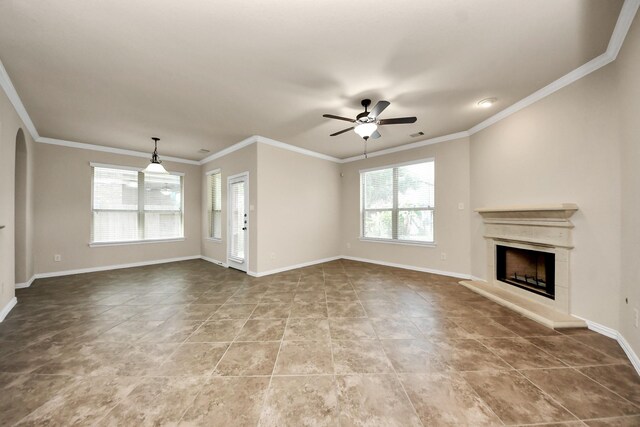 12131 Cove Ridge Ln, Cypress, TX 77433 - unfurnished living room featuring a fireplace with raised hearth, a ceiling fan, crown molding, and tile patterned floors