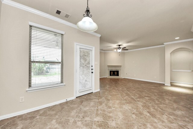12131 Cove Ridge Ln, Cypress, TX 77433 - unfurnished living room featuring ornamental molding, a ceiling fan, a fireplace with raised hearth, and light tile patterned flooring
