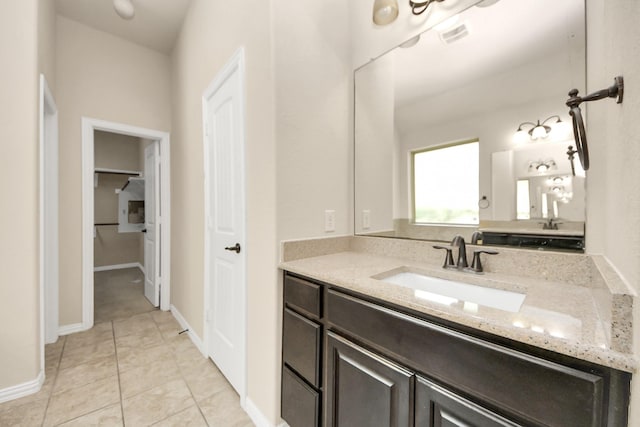 12131 Cove Ridge Ln, Cypress, TX 77433 - bathroom with vanity, a closet, and tile patterned flooring