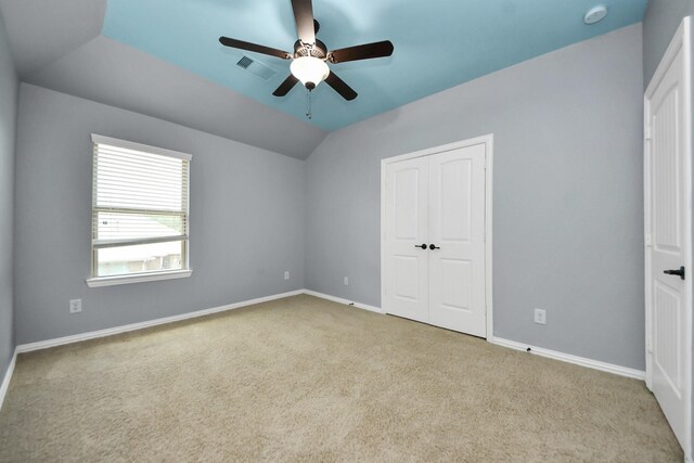 12131 Cove Ridge Ln, Cypress, TX 77433 - unfurnished bedroom with carpet, a closet, lofted ceiling, and a ceiling fan