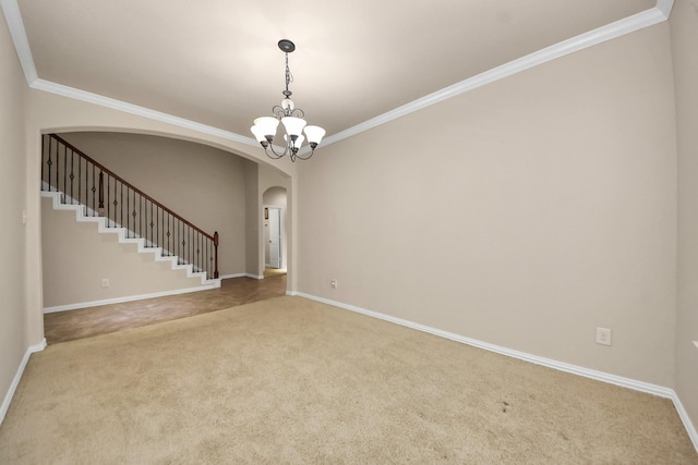 12131 Cove Ridge Ln, Cypress, TX 77433 - carpeted spare room featuring arched walkways, crown molding, stairway, and a chandelier