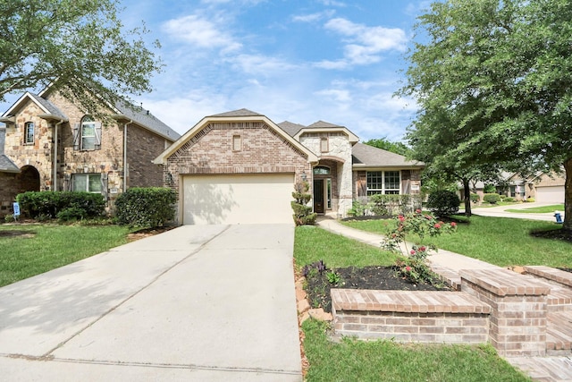 12131 Cove Ridge Ln, Cypress, TX 77433 - french country style house with a garage, a front lawn, concrete driveway, brick siding, and roof with shingles