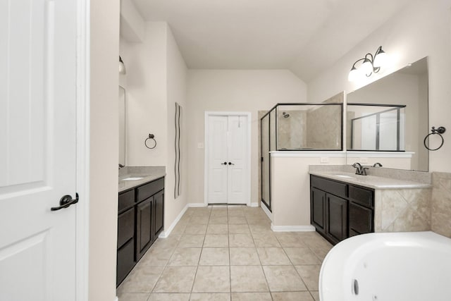 12131 Cove Ridge Ln, Cypress, TX 77433 - bathroom featuring two vanities, a stall shower, a whirlpool tub, and tile patterned floors