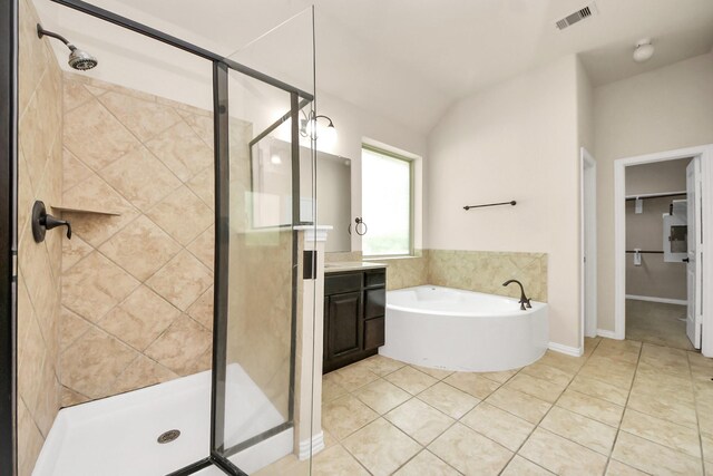 12131 Cove Ridge Ln, Cypress, TX 77433 - full bathroom with a shower stall, vanity, a garden tub, tile patterned floors, and a spacious closet