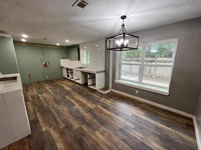 17506 Rustington Dr, Spring, TX 77379 - kitchen with wood finished floors, plenty of natural light, a chandelier, recessed lighting, and light countertops