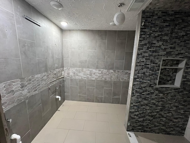 17506 Rustington Dr, Spring, TX 77379 - full bath with a tile shower and a textured ceiling