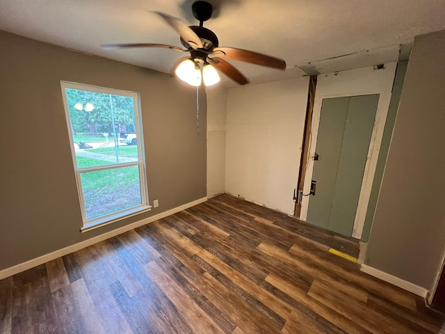 17506 Rustington Dr, Spring, TX 77379 - unfurnished room with dark wood-style flooring and a ceiling fan