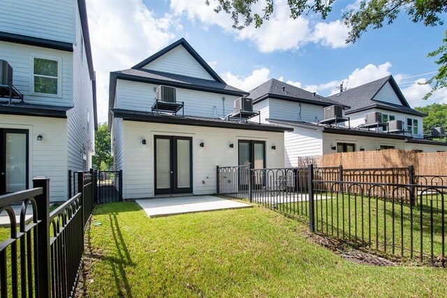 5119 Briscoe St A/B, Unit A/B Houston, TX 77033 - rear view of house with french doors, a patio area, and a fenced backyard