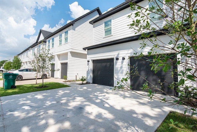 5119 Briscoe St A/B, Unit A/B Houston, TX 77033 - view of front of property featuring an attached garage and concrete driveway