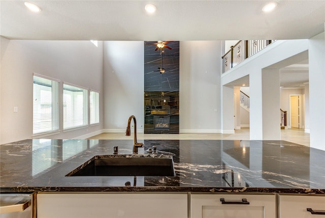 3242 N Upland St, Katy, TX 77493 - kitchen featuring dark stone counters, white cabinetry, ceiling fan, recessed lighting, and stainless steel dishwasher