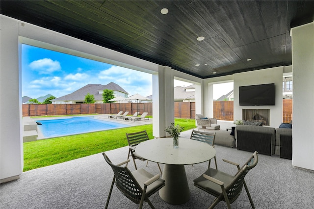 3242 N Upland St, Katy, TX 77493 - fenced backyard with an outdoor living space with a fireplace and a patio