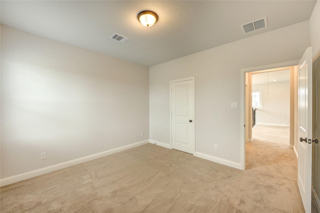 3242 N Upland St, Katy, TX 77493 - unfurnished bedroom with light colored carpet and baseboards