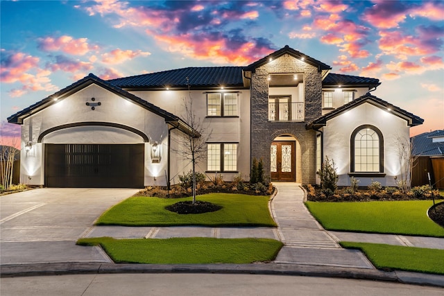 3242 N Upland St, Katy, TX 77493 - view of front facade with french doors, stucco siding, a front lawn, driveway, and an attached garage
