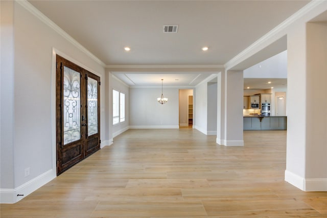 3242 N Upland St, Katy, TX 77493 - entrance foyer with french doors, a chandelier, ornamental molding, light wood finished floors, and recessed lighting