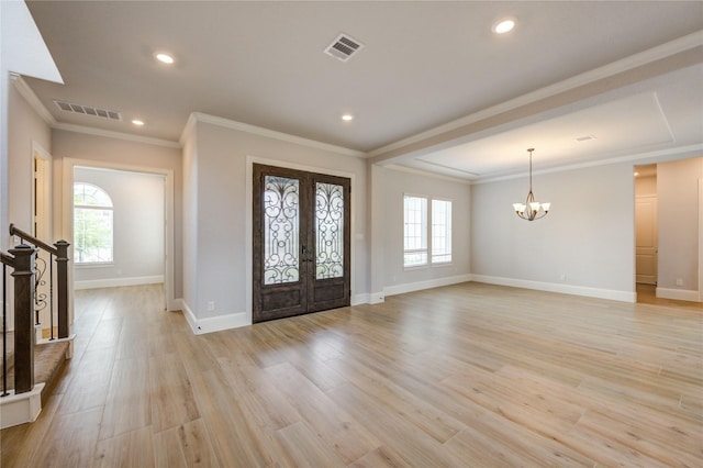 3242 N Upland St, Katy, TX 77493 - foyer featuring a chandelier, french doors, light wood finished floors, ornamental molding, and recessed lighting